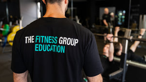 A member of The Fitness Group Team working with a client