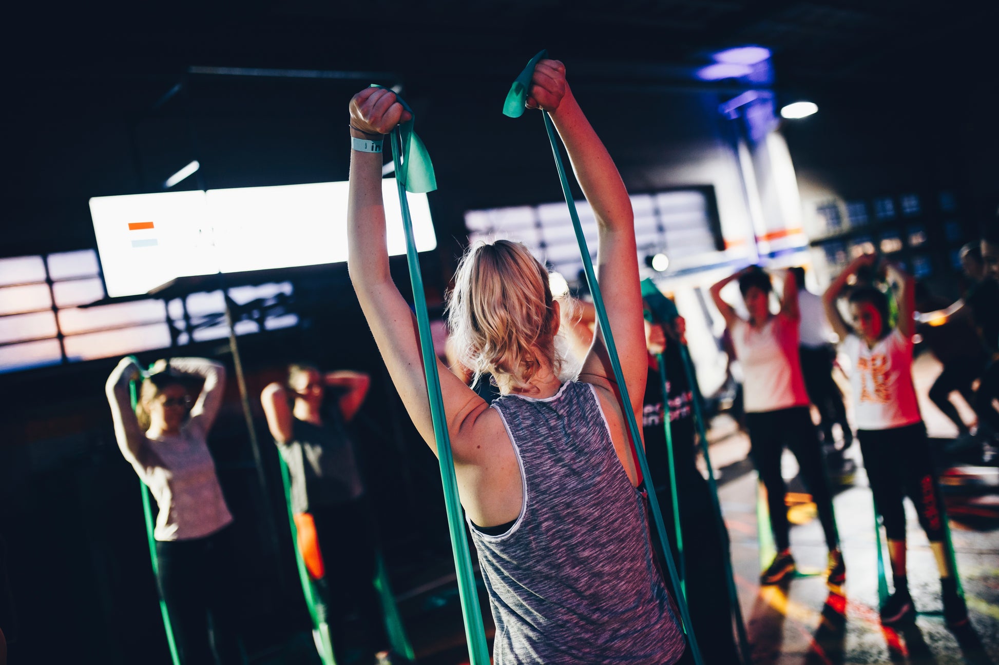 A group exercise instructor leading a class