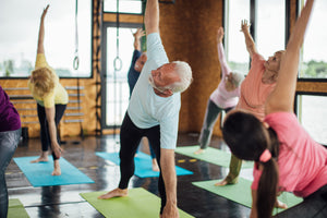 Group of seniors attending a yoga class.